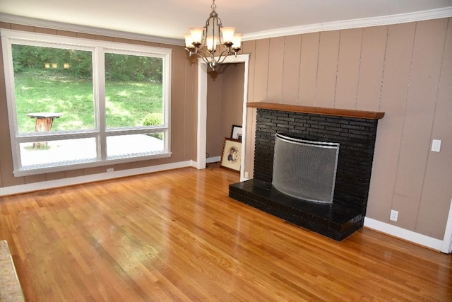 1314 Burton Valley Rd, Nashville, TN 37215 - unfurnished living room with light wood-style floors, baseboards, a fireplace, a chandelier, and ornamental molding