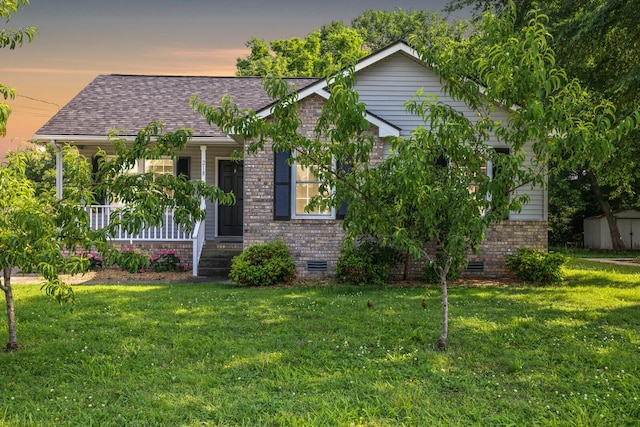 218 Westlynn Dr, Lebanon, TN 37087 - view of front facade featuring crawl space, a front lawn, brick siding, roof with shingles, and a porch