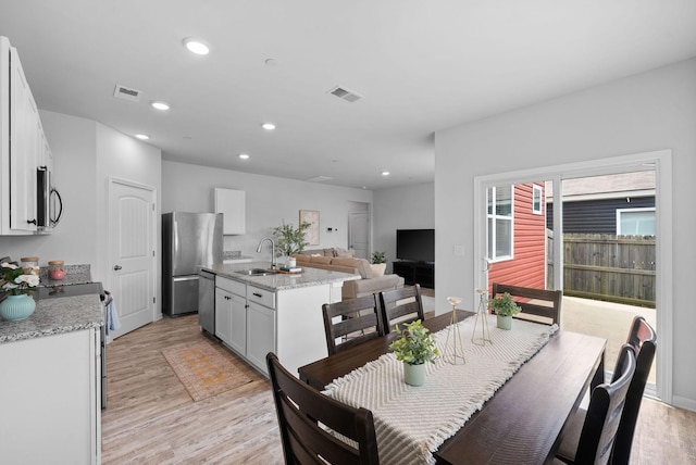 148 Victory Cir, Ashland City, TN 37015 - dining area with light wood-type flooring and recessed lighting