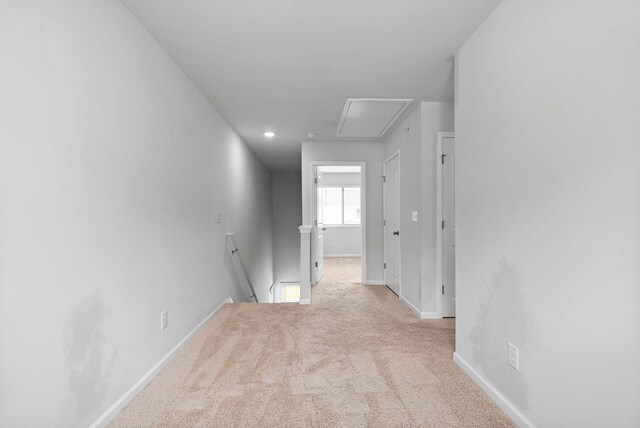 148 Victory Cir, Ashland City, TN 37015 - hallway featuring attic access, an upstairs landing, carpet, and baseboards