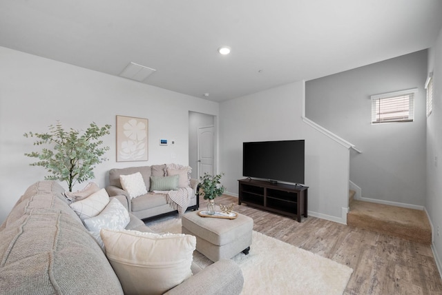 148 Victory Cir, Ashland City, TN 37015 - living room featuring stairway, light wood finished floors, baseboards, and recessed lighting
