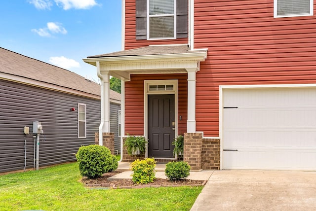 148 Victory Cir, Ashland City, TN 37015 - view of exterior entry featuring a garage and concrete driveway