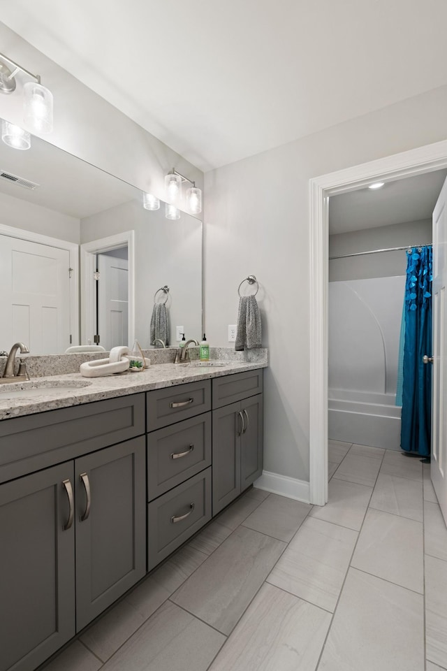 290 Academy Rd, Lebanon, TN 37087 - bathroom with double vanity, shower / bathtub combination with curtain, baseboards, and marble finish floors