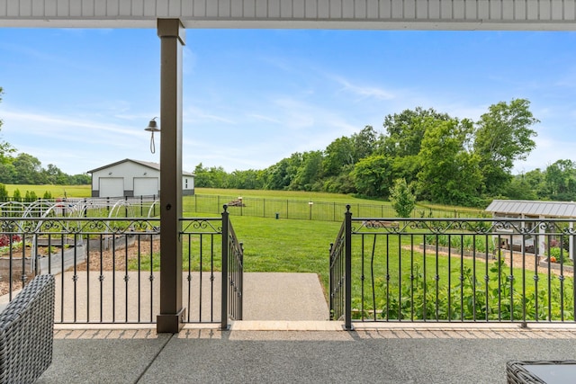 290 Academy Rd, Lebanon, TN 37087 - view of patio / terrace featuring a gate, a detached garage, an outdoor structure, and a view of rural / pastoral area