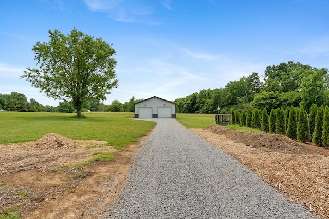 290 Academy Rd, Lebanon, TN 37087 - view of front of house with a garage, an outbuilding, and a front yard