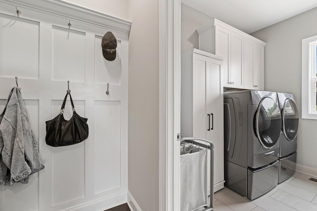 290 Academy Rd, Lebanon, TN 37087 - laundry room featuring separate washer and dryer, baseboards, cabinet space, and light tile patterned floors
