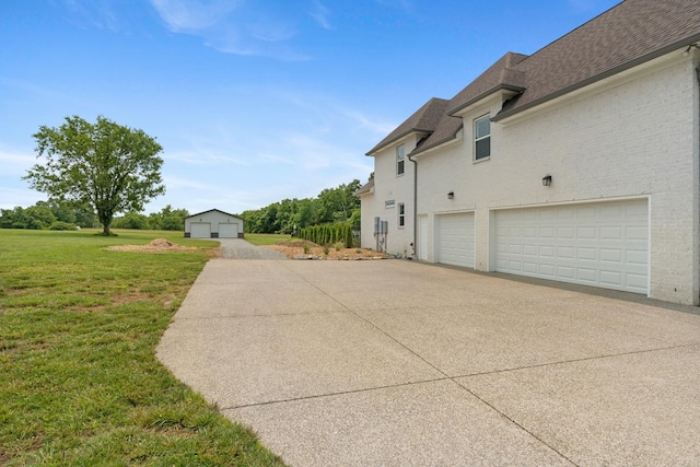 290 Academy Rd, Lebanon, TN 37087 - view of home's exterior featuring concrete driveway, a garage, a lawn, brick siding, and a shingled roof