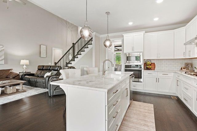 290 Academy Rd, Lebanon, TN 37087 - kitchen with stainless steel appliances, dark wood-type flooring, a sink, light stone countertops, and decorative backsplash