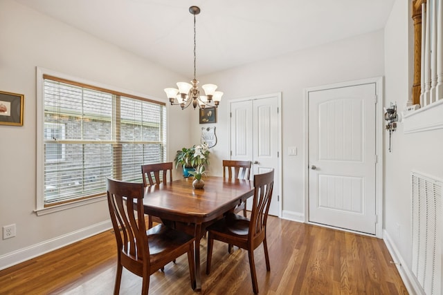 2090 Lequire Ln, Spring Hill, TN 37174 - dining room with a chandelier, wood finished floors, and baseboards