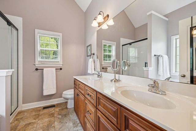 2090 Lequire Ln, Spring Hill, TN 37174 - bathroom featuring vaulted ceiling, a shower stall, toilet, double vanity, and baseboards