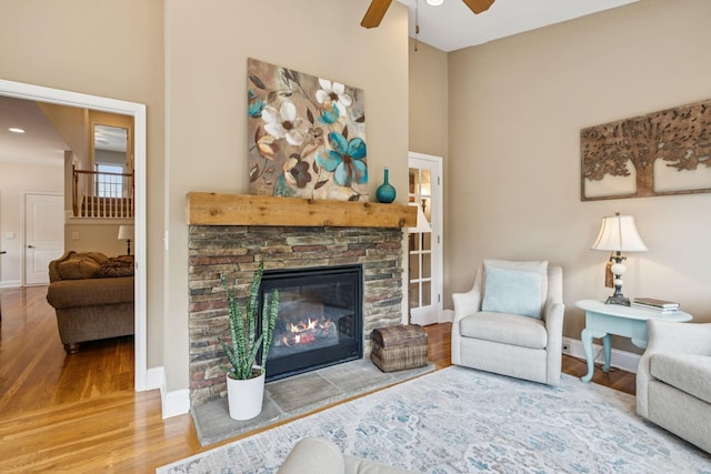 2090 Lequire Ln, Spring Hill, TN 37174 - living area featuring ceiling fan, wood finished floors, baseboards, and a fireplace