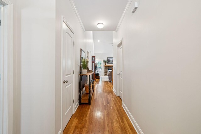 2090 Lequire Ln, Spring Hill, TN 37174 - hallway featuring light wood-type flooring, ornamental molding, and baseboards