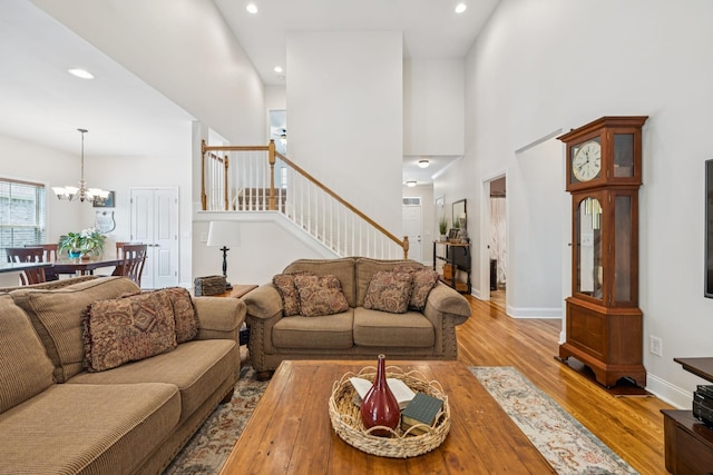 2090 Lequire Ln, Spring Hill, TN 37174 - living area with stairs, wood finished floors, a chandelier, recessed lighting, and baseboards