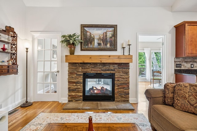 2090 Lequire Ln, Spring Hill, TN 37174 - living room featuring wood finished floors, baseboards, and a fireplace
