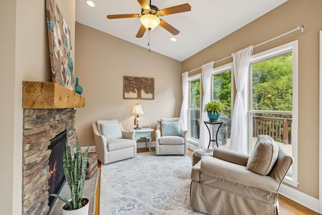 2090 Lequire Ln, Spring Hill, TN 37174 - living area featuring lofted ceiling, baseboards, ceiling fan, a stone fireplace, and wood finished floors