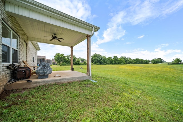 1426 Alamo Ave, Murfreesboro, TN 37129 - view of grassy yard with a ceiling fan and a patio