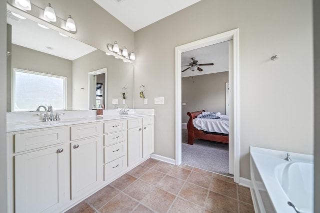 1426 Alamo Ave, Murfreesboro, TN 37129 - ensuite bathroom featuring double vanity, a bath, baseboards, and a ceiling fan