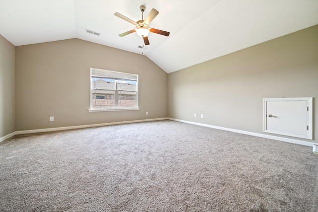 1426 Alamo Ave, Murfreesboro, TN 37129 - unfurnished room featuring a ceiling fan, carpet flooring, lofted ceiling, and baseboards