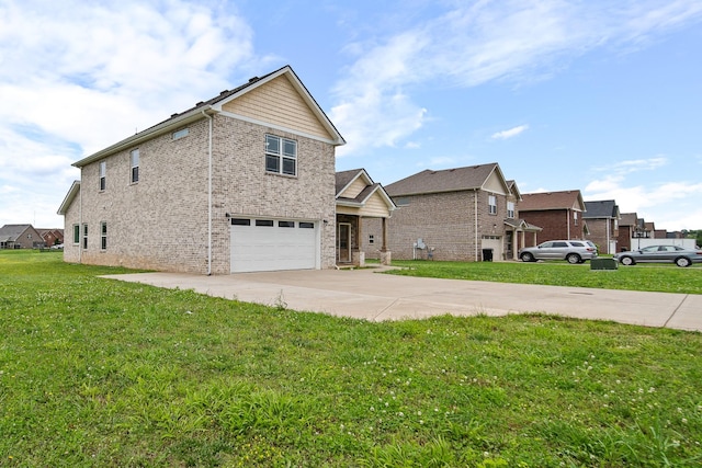 1426 Alamo Ave, Murfreesboro, TN 37129 - view of front facade with concrete driveway, an attached garage, brick siding, and a front yard