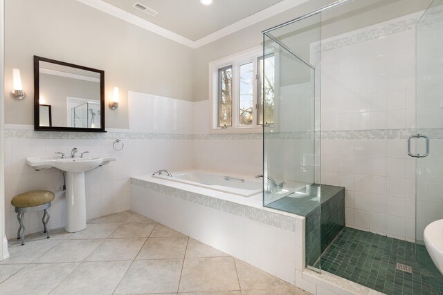 1107 Stonebridge Park Dr, Franklin, TN 37069 - bathroom with a bath, tile patterned flooring, a stall shower, crown molding, and tile walls