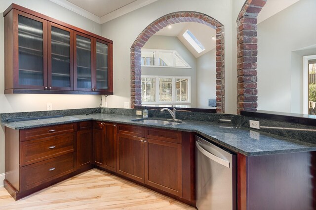 1107 Stonebridge Park Dr, Franklin, TN 37069 - kitchen with dishwasher, a sink, dark stone counters, light wood-style flooring, and glass insert cabinets