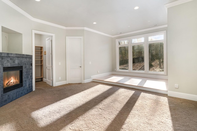 1107 Stonebridge Park Dr, Franklin, TN 37069 - unfurnished living room with carpet, a tiled fireplace, crown molding, baseboards, and recessed lighting