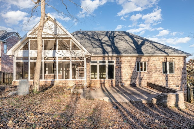 1107 Stonebridge Park Dr, Franklin, TN 37069 - back of property with a sunroom, brick siding, a patio, and roof with shingles