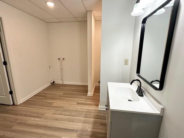 807 Poplar Dr, Centerville, TN 37033 - bathroom featuring vanity, wood finished floors, baseboards, a paneled ceiling, and recessed lighting
