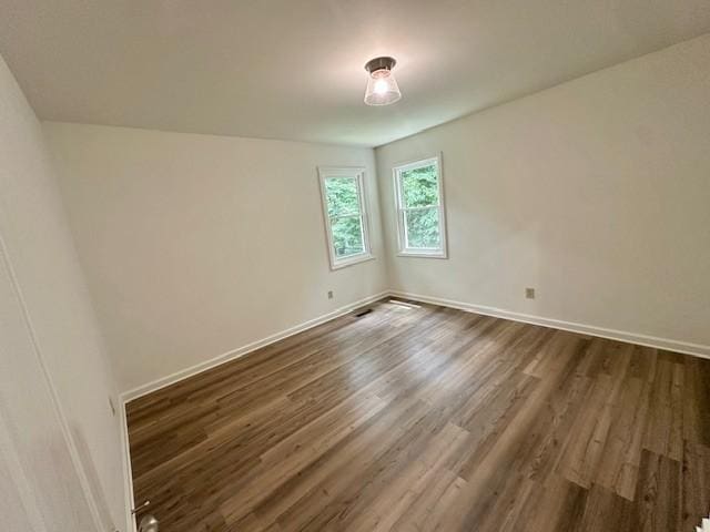807 Poplar Dr, Centerville, TN 37033 - unfurnished room with dark wood-type flooring and baseboards