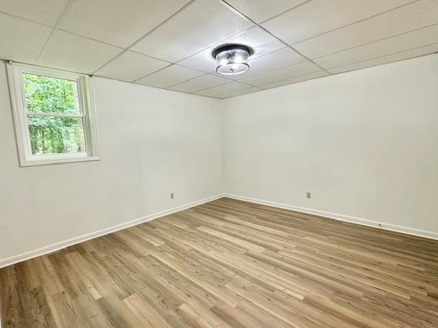 807 Poplar Dr, Centerville, TN 37033 - unfurnished room featuring wood finished floors, baseboards, and a drop ceiling