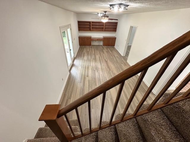 807 Poplar Dr, Centerville, TN 37033 - staircase featuring ceiling fan, baseboards, wood finished floors, and a textured ceiling