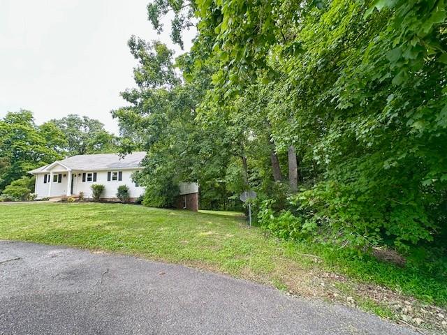 807 Poplar Dr, Centerville, TN 37033 - view of front of home with a front lawn