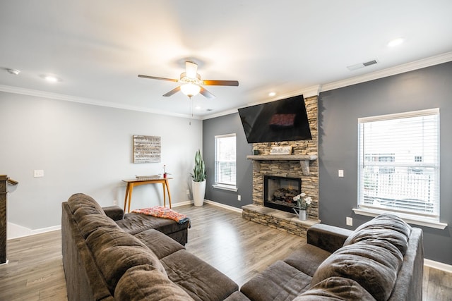 1110 Colonel Reuben Searcy Ct, Murfreesboro, TN 37129 - living area featuring a fireplace, ceiling fan, baseboards, wood finished floors, and crown molding