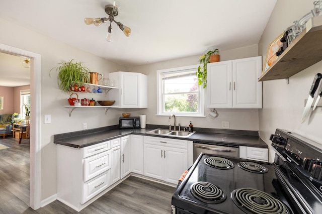 102 Lyle Ln, Nashville, TN 37210 - kitchen featuring electric stove, a sink, dishwashing machine, dark countertops, and white cabinetry