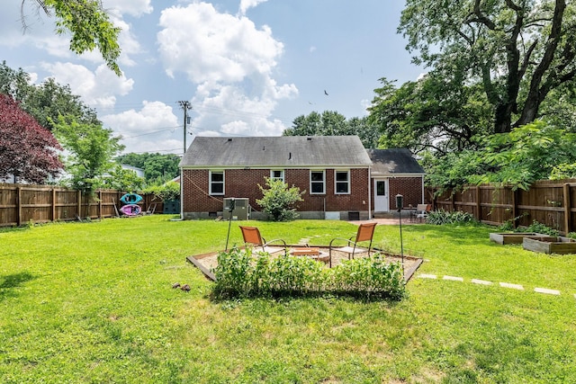 102 Lyle Ln, Nashville, TN 37210 - back of property with a garden, a patio, a fire pit, and brick siding