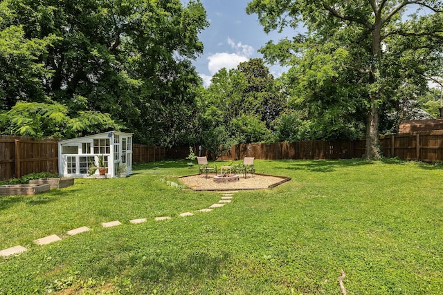 102 Lyle Ln, Nashville, TN 37210 - view of yard featuring an outdoor fire pit, a vegetable garden, and an outbuilding