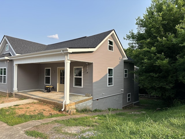 120 Union St, Clarksville, TN 37040 - view of side of home with a shingled roof and a patio