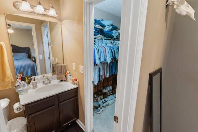 2541 Jackalope St, Murfreesboro, TN 37130 - bathroom featuring vanity, ceiling fan, a spacious closet, and toilet