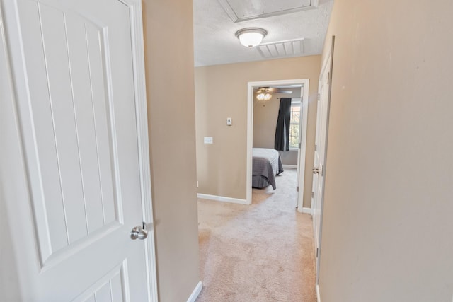 2541 Jackalope St, Murfreesboro, TN 37130 - hallway featuring light colored carpet, baseboards, and attic access
