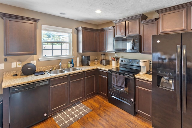 2541 Jackalope St, Murfreesboro, TN 37130 - kitchen featuring black appliances, a sink, dark wood finished floors, dark brown cabinets, and a textured ceiling