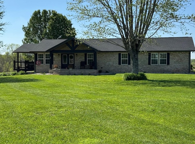 285 Shrum Ln, Lafayette, TN 37083 - ranch-style house with a front yard, brick siding, and a porch