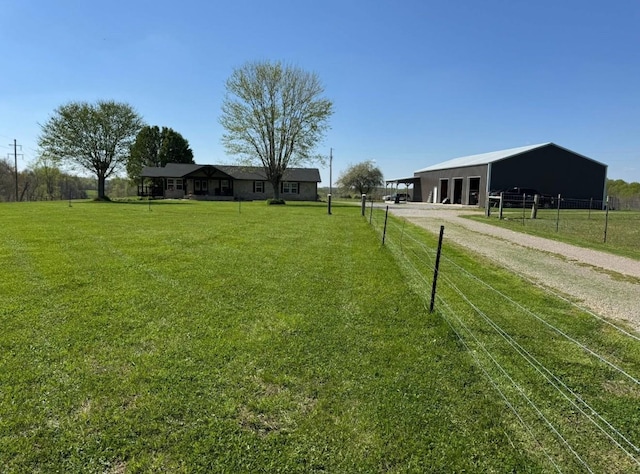 285 Shrum Ln, Lafayette, TN 37083 - view of yard with driveway, an outbuilding, and a pole building