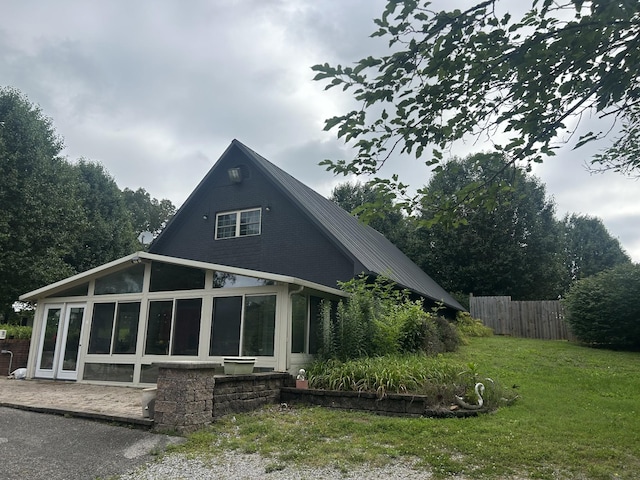 2449 Buffalo Rd, Lawrenceburg, TN 38464 - back of house featuring a sunroom