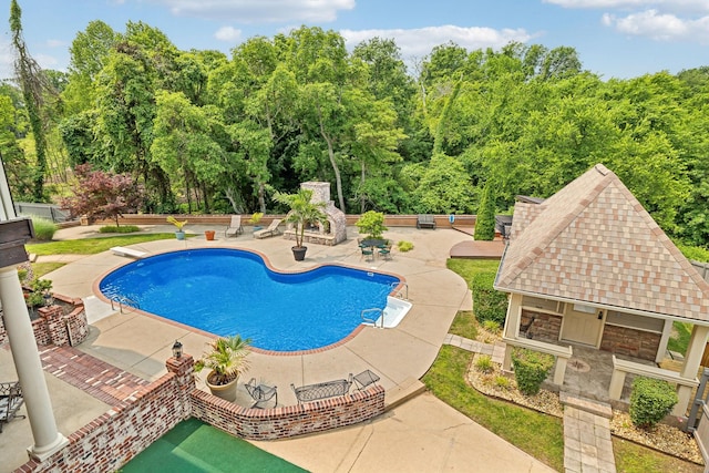 226 Hidden Harbour Dr, Mount Juliet, TN 37122 - swimming pool featuring a patio and a fireplace