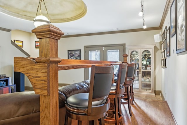 226 Hidden Harbour Dr, Mount Juliet, TN 37122 - dining area featuring track lighting, ornamental molding, wood finished floors, and baseboards
