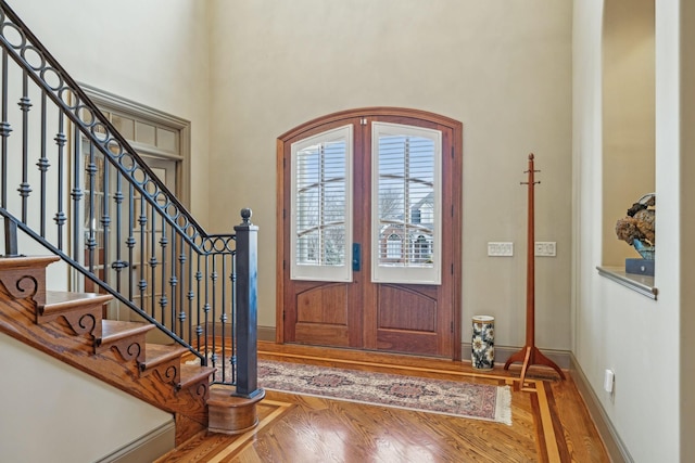 226 Hidden Harbour Dr, Mount Juliet, TN 37122 - foyer entrance featuring a towering ceiling, wood finished floors, baseboards, stairway, and french doors