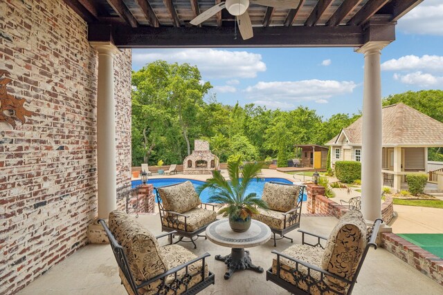 226 Hidden Harbour Dr, Mount Juliet, TN 37122 - view of patio / terrace with a brick fireplace, a ceiling fan, an outdoor pool, and an outdoor structure