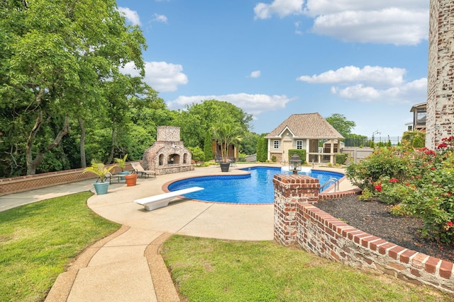 226 Hidden Harbour Dr, Mount Juliet, TN 37122 - swimming pool with an outdoor stone fireplace, a patio area, a diving board, an exterior structure, and an outdoor structure