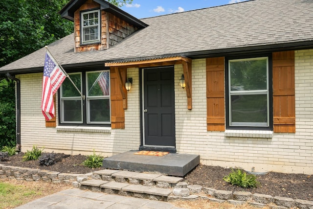 109 Hazelwood Dr, Hendersonville, TN 37075 - view of exterior entry with a shingled roof and brick siding