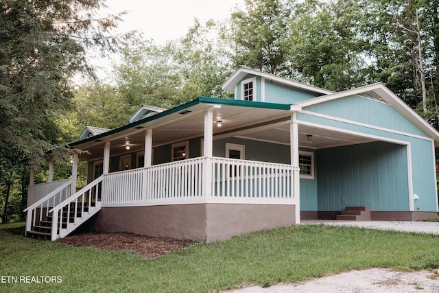1799 Baker Hwy, Huntsville, TN 37756 - view of front of house with covered porch, a front yard, and stairs